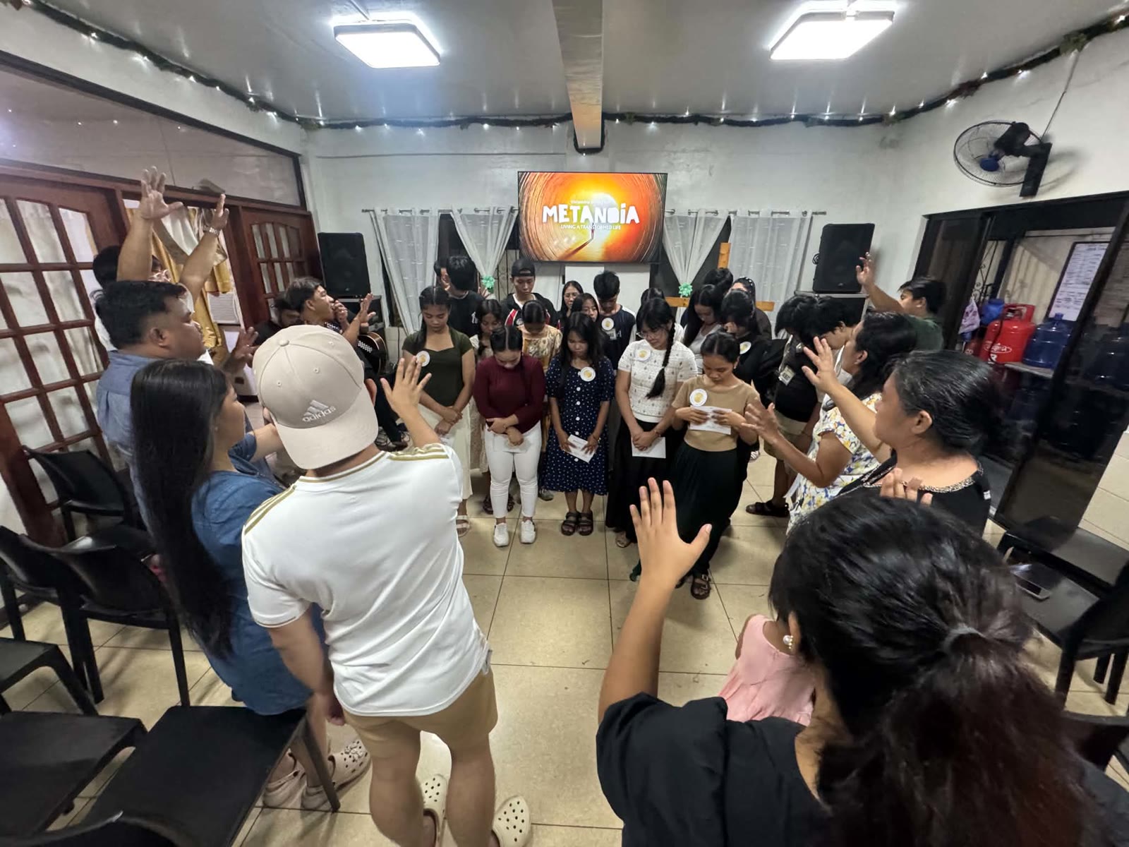 Discipleship Training Week participants praying together during the Metanoia week